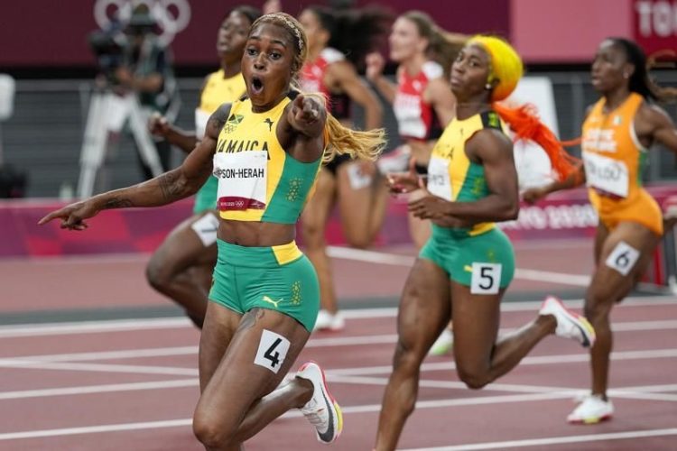 01_thompson_herah_breaks_flo_jo_olympic_record_women_100.jpg