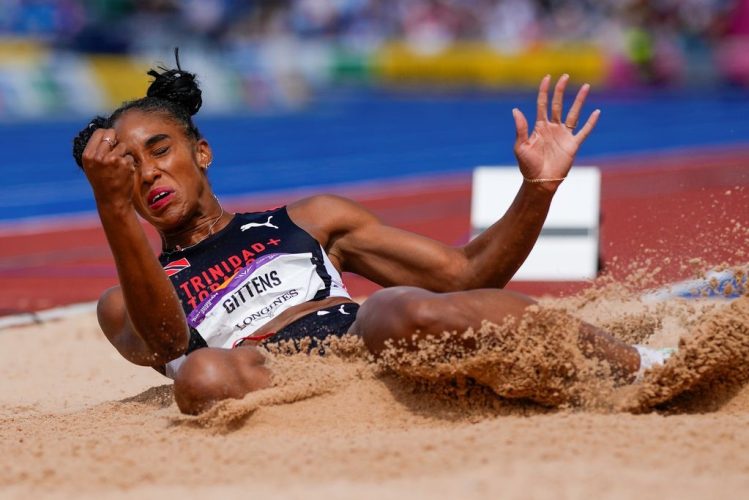 05_gittens_qualifies_long_jump_final_mens_4x400_team.jpg