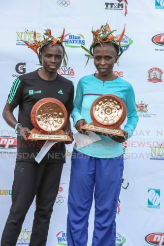 26_njoroge_completes_hat_trick_tt_intl_marathon.jpg